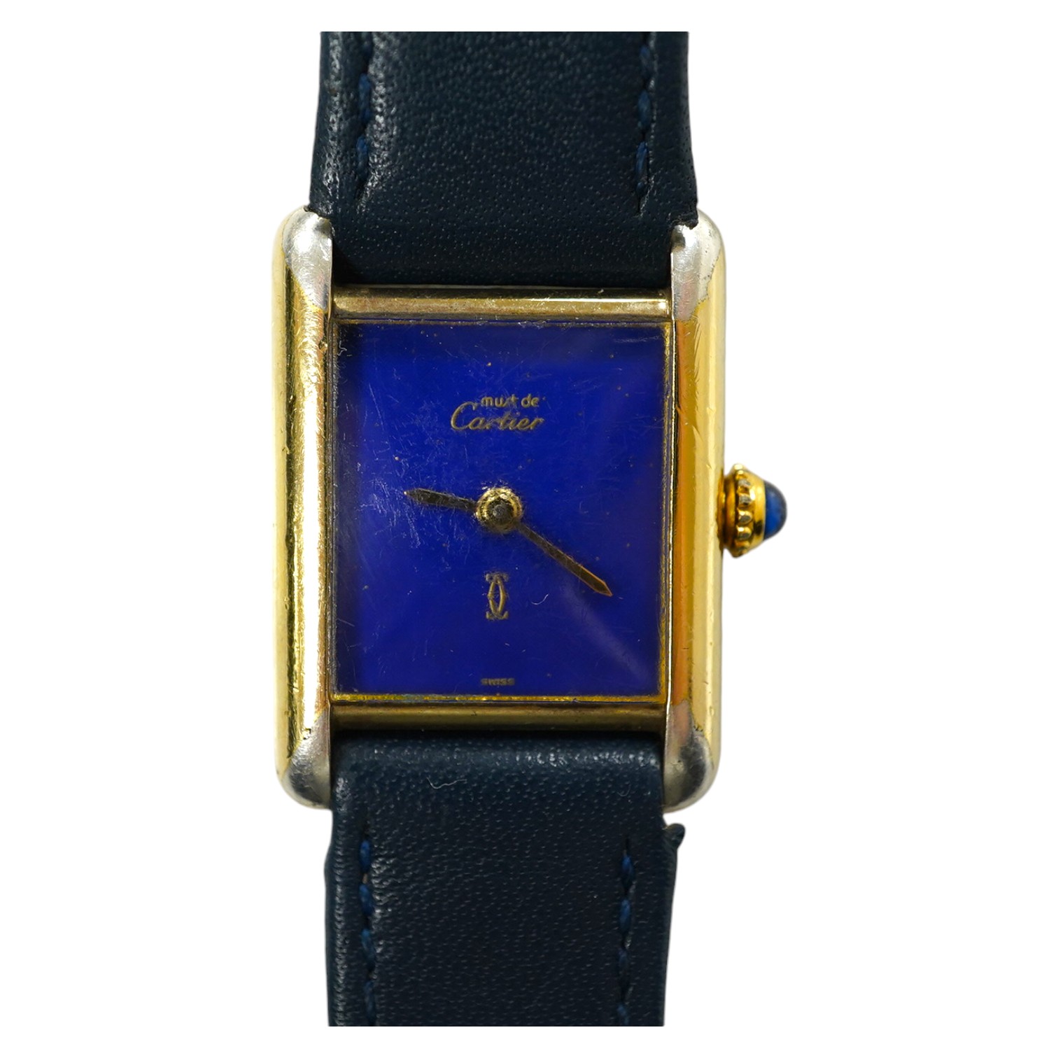 A lady's gilt 925 Must De Cartier manual wind wrist watch, with lapis lazuli rectangular dial and cabochon sapphire set winding crown, on an associated leather strap, case diameter 20mm, no box or papers. Condition - poo